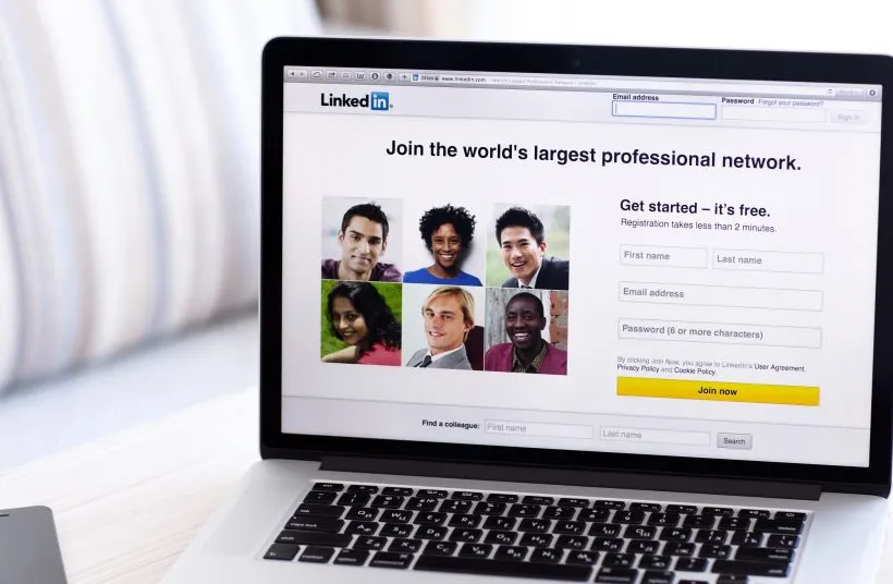 A laptop showing the LinkedIn sign-up page