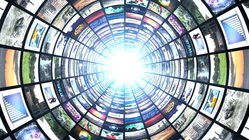 A tunnel of screens receding towards a bright light