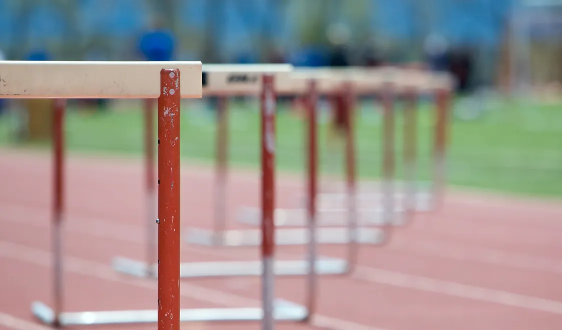 A line of hurdles on an athletics track