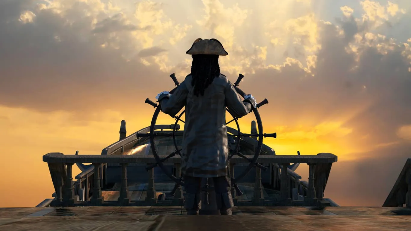 A figure at a ship's wheel steering into a sunset