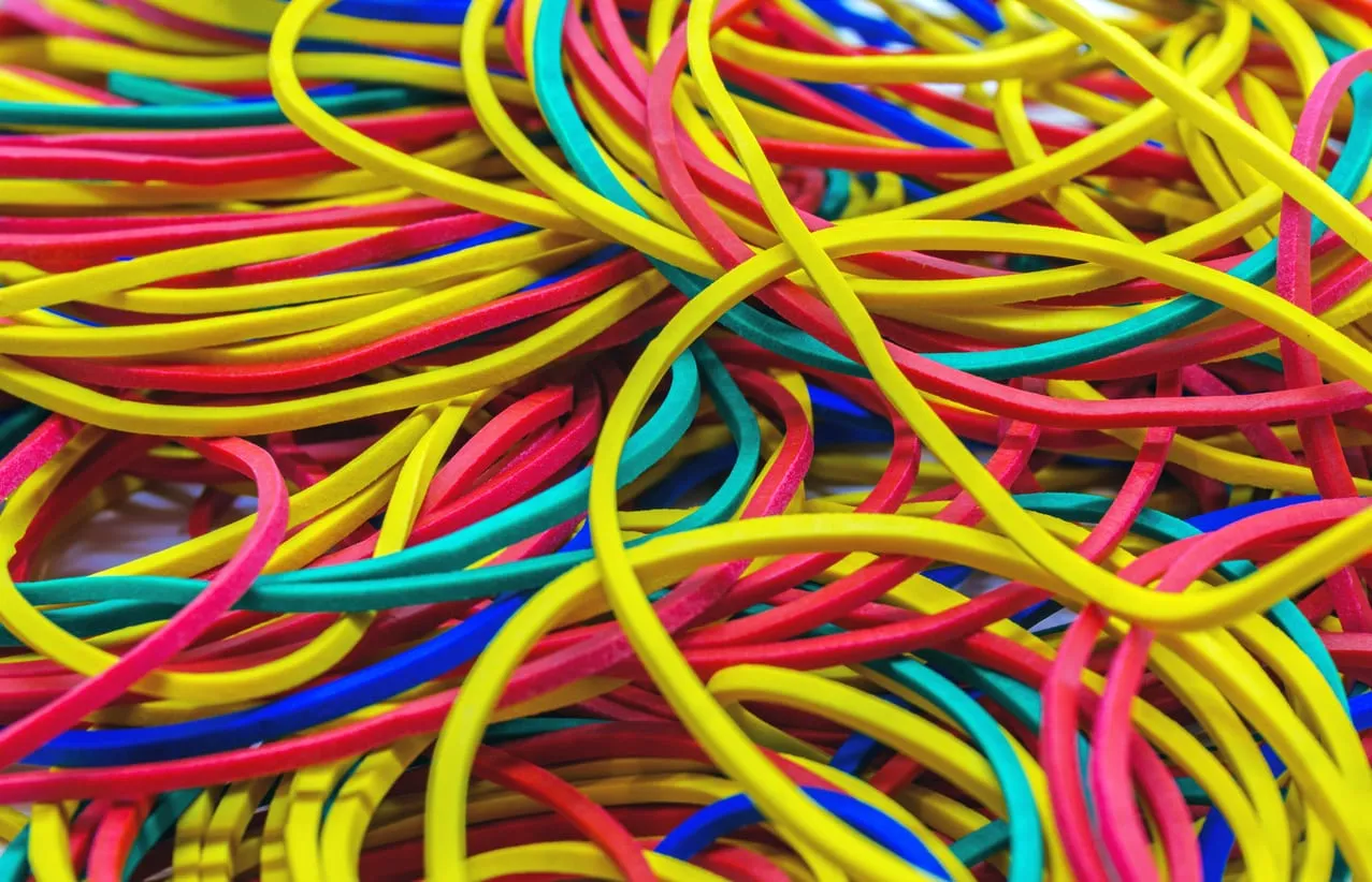 A tangle of brightly coloured cables in pink, yellow and blue