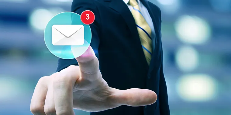 A man in a suit tapping a floating email icon with three unread messages