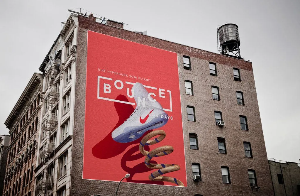 A large Nike trainer mural painted on the side of a brick building