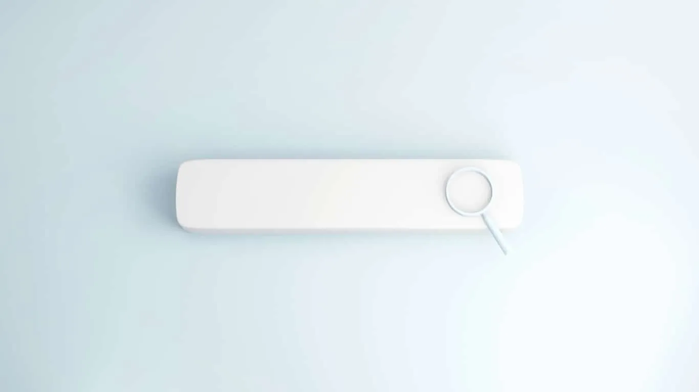 A blank white search bar on a pale background