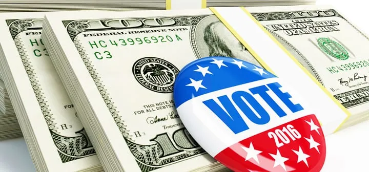 A Vote 2016 campaign badge resting on stacks of banknotes