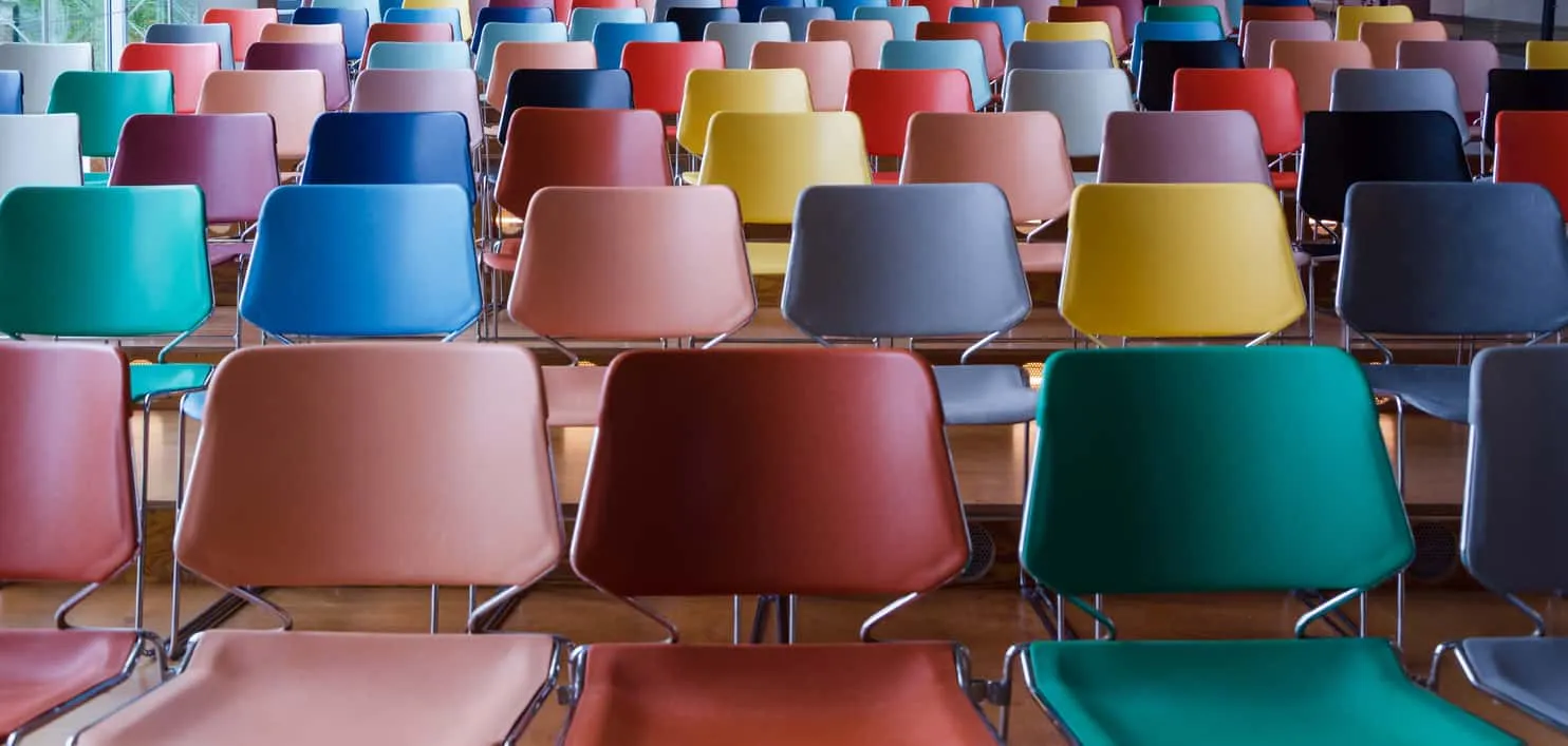 Rows of empty chairs in bright colours