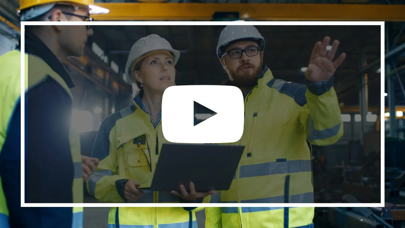 Video thumbnail with a play button, showing two engineers in hard hats and hi-vis reviewing a laptop