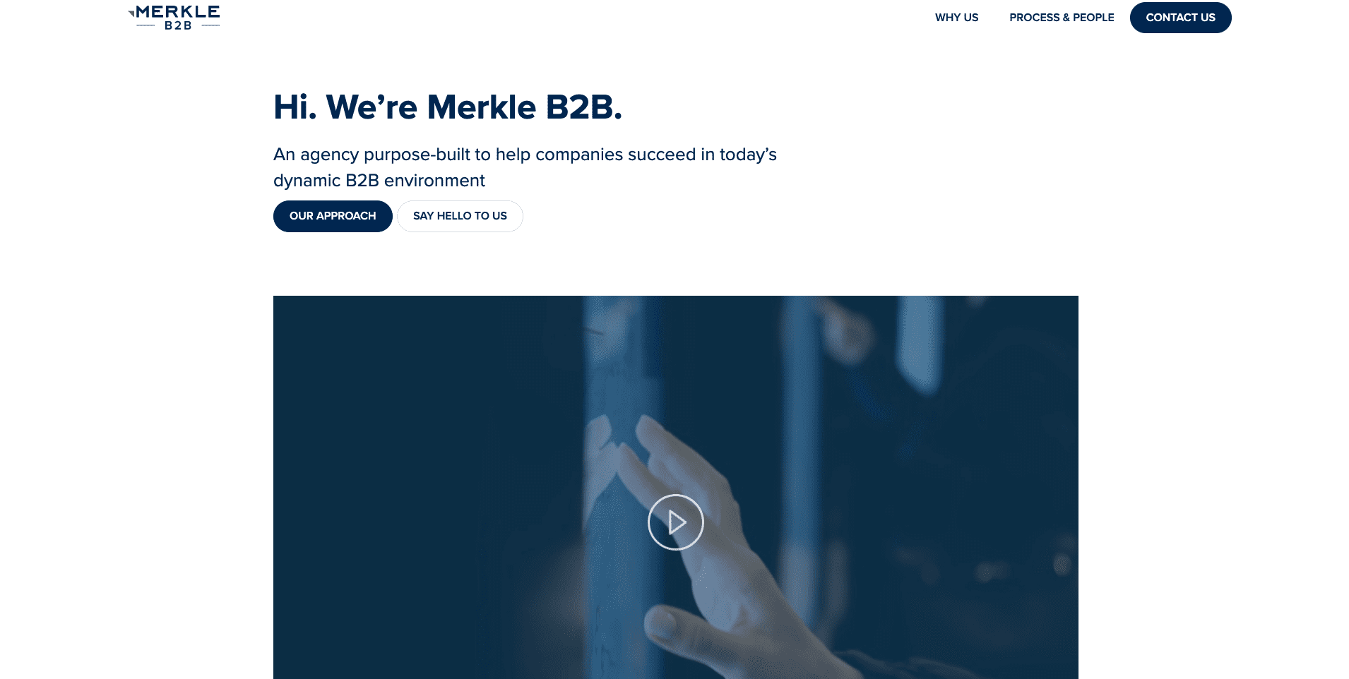 Agency website page with white background and blue text that says "Hi. We're Merkle B2B" and a video thumbnail of a hand tapping a screen